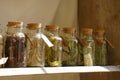 Various herbs in beautiful glasses on medieval market