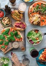 Various homemade pizza, different hot dogs, wine, beer and snack Royalty Free Stock Photo