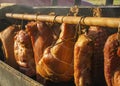 Various homemade smoked meat during smoking process Royalty Free Stock Photo