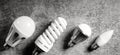 Various household lamp bulbs with e27 base on gray background Royalty Free Stock Photo