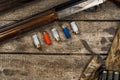 Various hunting equipment on old wooden background