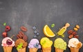 Various of ice cream flavor in cones blueberry ,green tea ,pistachio ,almond ,orange and cherry setup on dark stone background . Royalty Free Stock Photo