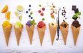 Various of ice cream flavor in cones blueberry ,lime ,pistachio ,almond ,orange ,chocolate ,vanila and coffee setup on shappy Royalty Free Stock Photo