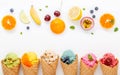 Various of ice cream flavor in cones blueberry ,strawberry ,pistachio ,almond ,orange and cherry setup on white wooden background Royalty Free Stock Photo