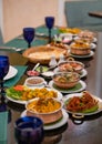 Various Indian food with meat, curry, soup and spicy taste on the table