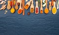 Various of Indian spices and herbs in wooden spoons. Flat lay of spices ingredients chilli ,pepper, garlic,dries thyme, cinnamon,