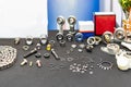 Various industrial metal parts e.g. bearing ball chain connector joint ring gasket internal external retaining etc. on table