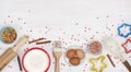 Various ingredients for cooking christmas baking on light wooden background