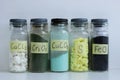 Various inorganic mineral chemicals in glass jars.