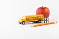 Various items for back to school against a bright white background. Royalty Free Stock Photo