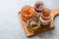 Various Jar of Fruit Jams Fig, Quince, Bergamot Citrus, Watermelon on Wooden Tray / Marmalade. Royalty Free Stock Photo