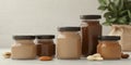 Various jars of nut butters displayed elegantly on a kitchen countertop Royalty Free Stock Photo