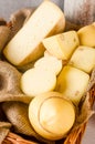 Various kind of craft cheese. Cheese assortment of different types of hard and soft cheeses