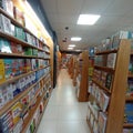 various kinds of books lined up on bookshelves in a bookstore