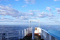 Various kinds of colorful blue sky, white clouds and open spaces of the world ocean. Seascapes. View from the side of a sea ship w Royalty Free Stock Photo