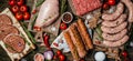 Various kinds of grill and bbq raw meats. Chicken, steak, sausages, minced beef meat kebabs, pork with herbs, spices on wooden Royalty Free Stock Photo