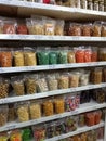 Various kinds of pastries neatly packaged are arranged on the cake shop shelves