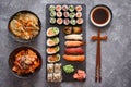 Various kinds of sushi placed on black stone board Royalty Free Stock Photo