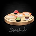 Various kinds of sushi served on wood desk black background