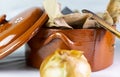 Wooden spoon and clay vessel to store cooking ingredients