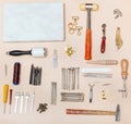 Various leather craft instruments and marble board Royalty Free Stock Photo