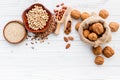 Various legumes and different kinds of nuts set up on wooden table Royalty Free Stock Photo