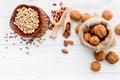 Various legumes and different kinds of nuts set up on wooden table Royalty Free Stock Photo