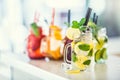 Various lemonades in mason jars with orange lime lemon otange st Royalty Free Stock Photo