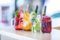 Various lemonades in mason jars with orange lime lemon otange st