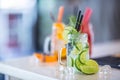 Various lemonades in mason jars with orange lime lemon otange st