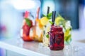 Various lemonades in mason jars with orange lime lemon otange st