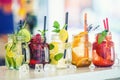 Various lemonades in mason jars with orange lime lemon otange st Royalty Free Stock Photo