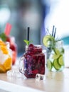 Various lemonades in mason jars with orange lime lemon otange st