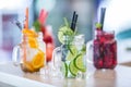 Various lemonades in mason jars with orange lime lemon otange st