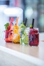 Various lemonades in mason jars with orange lime lemon otange st