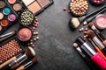 Various makeup products on dark background with copyspace Royalty Free Stock Photo