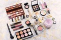 Various makeup products on table, flat design. Woman cosmetic essentials, top view Royalty Free Stock Photo