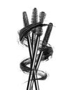 Various mascara brushes wrapped in a smear