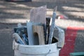 Various masonry and brickwork tools being used on a construction site