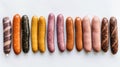 Various meat fresh sausages lie in a row, white background, isolate. AI generated.