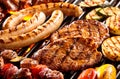 Various meats and vegetables on hot grill