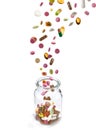 Various medical pills falling into glass jar