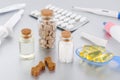 Various medical products for animal, natural supplement, oil, medicine and treats like bones on gray background