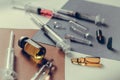 Various medications, medications and syringes on a light table. Royalty Free Stock Photo