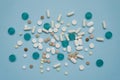 Various medications in tablets and wholesale on a blue background. Medical concept