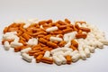 A big pile of white pills and orange pills Royalty Free Stock Photo