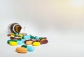 Various medicine pills, orange tablets, blue and green capsules Royalty Free Stock Photo