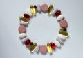 Various medicines, capsules and pills organised in a circle