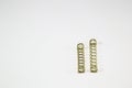 Various metal springs for different purposes, many small gold springs Royalty Free Stock Photo