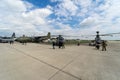 Various military and civil aviation equipment on the airfield.